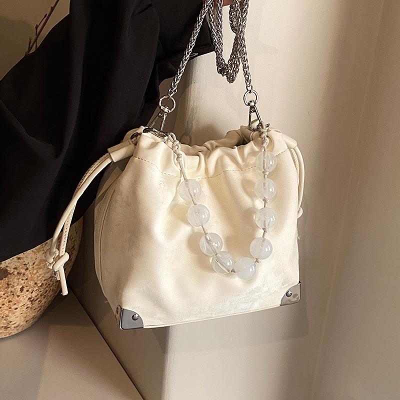 JINBAOSEN BAG De populaire fluwelen emmertas voor dames van dit jaar 2024 Nieuwe lente/zomer forensentas met enkele schoudertas Gepersonaliseerde parel crossbody tas