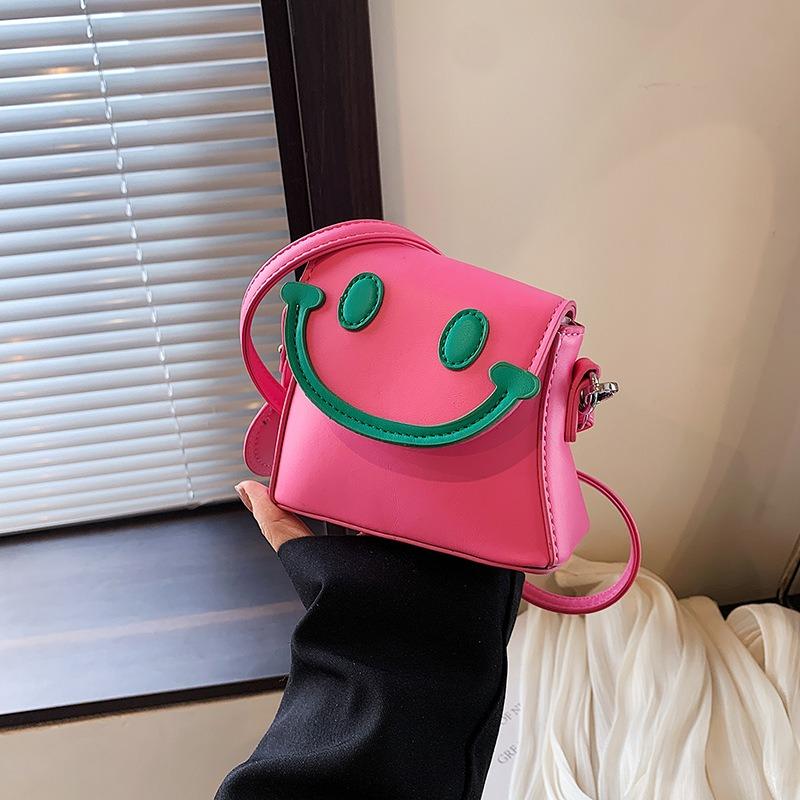 JINBAOSEN BAG 2024 Nieuwe schattige lachende gezicht creatieve meisjes tas veelzijdige casual kleine meisjes een schouder crossbody tas kindertas