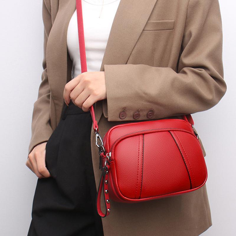 Versatile bag Effen kleur modieuze klinknagel rits dames mobiele telefoon tas eenvoudige zachte PU lederen schouder crossbody kleine vierkante handtas