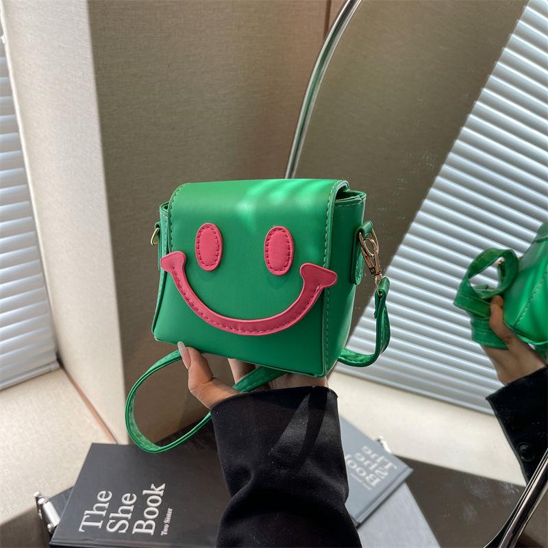 Fashion footsteps 2024 nieuwe niche schattige smiley gezicht creatieve contrasterende tas casual eenvoudige schoudertas kleine vierkante damestas roze roze kleur