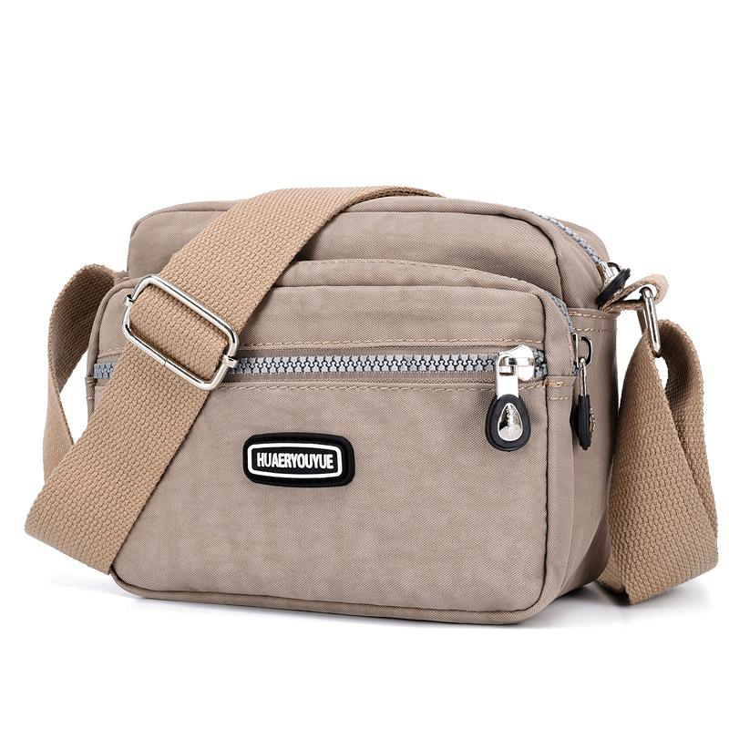 Yogodlns Vrouwen Waterdichte Nylon Schouder Messenger Bag Lichtgewicht Pakket Grote Capaciteit Casual Effen Kleur Reis Crossbody Tas Portemonnee 20x9x16cm beige