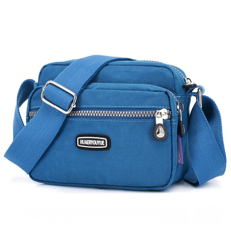 Yogodlns Vrouwen Waterdichte Nylon Schouder Messenger Bag Lichtgewicht Pakket Grote Capaciteit Casual Effen Kleur Reis Crossbody Tas Portemonnee 20x9x16cm meer blauwe kleur