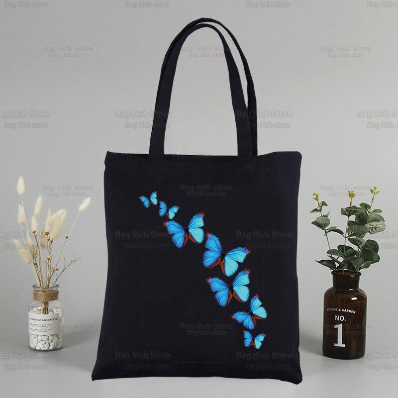 Iaidegou-2 Blauwe vlinderkleur vliegende bloem aangepaste tote tas winkelen origineel ontwerp zwarte unisex reis canvas tassen eco opvouwbare shopper