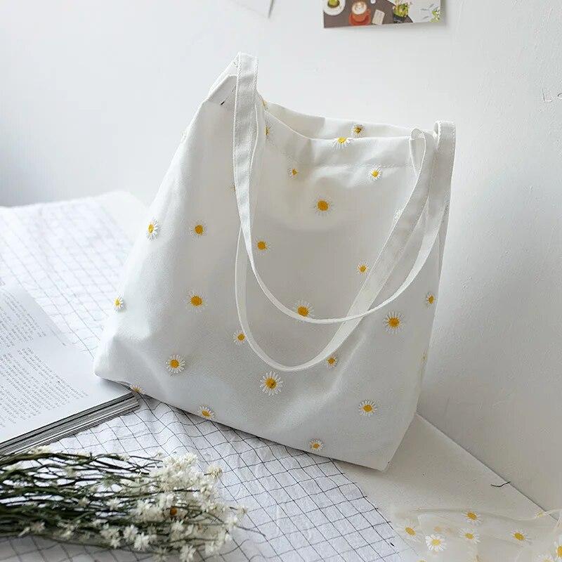 HaiKouLiJinHaiKeJiYouXianGongSi Kleine canvas draagtas voor dames meisjes Shopper Designer handtas Casual borduurwerk met madeliefje gehaakte schattige mesh schoudertassen wit