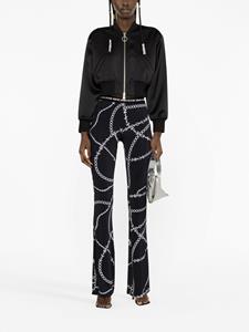 Versace chain-print flared trousers - Zwart