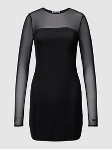 REVIEW Mini-jurk met semi-transparante garnering