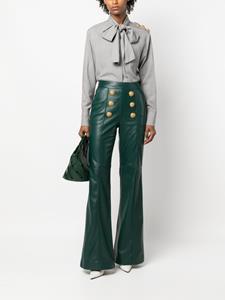 Balmain button-embellished leather flared trousers - Groen