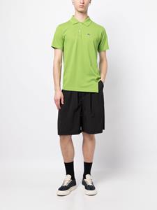 Comme Des Garçons Shirt x Lacoste asymmetric logo-patch polo shirt - Groen