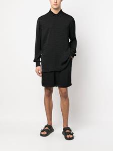 Moschino Shorts met logoprint - Zwart