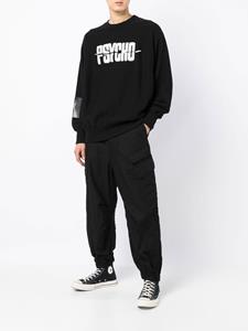 Undercover x Psycho sweater met patch - Zwart