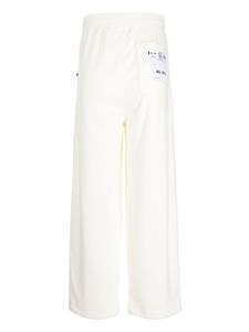 Izzue logo-patch straight trousers - Beige