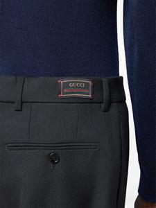 Gucci logo-appliqué pleat-detail tailored trousers - Zwart