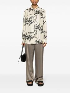 Nanushka Zijden blouse met print - Beige