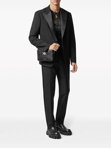 Versace Chino met toelopende pijpen en logo-applicatie - Zwart