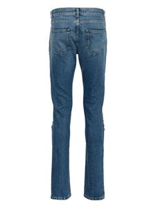 Saint Laurent ripped-detail slim-fit jeans - Blauw
