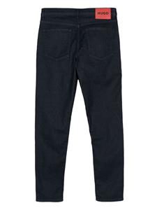 HUGO Jeans met logoplakkaat en toelopende pijpen - Blauw