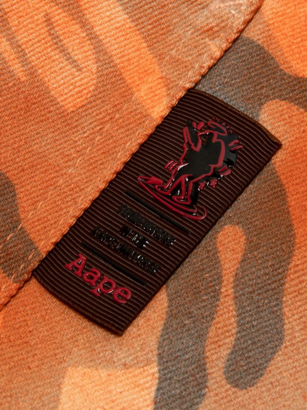 AAPE BY *A BATHING APE spray paint-effect camouflage trousers - Oranje