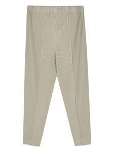 Homme Plissé Issey Miyake Compleat tapered-leg trousers - Groen