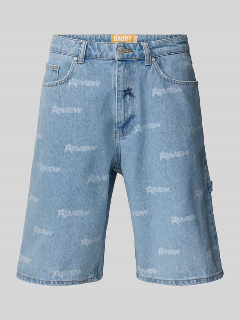 REVIEW Korte baggy fit jeans met labelprint