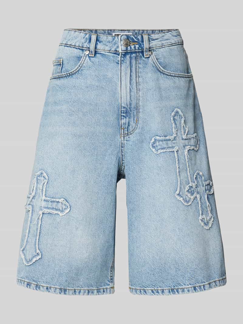 Review Korte baggy fit jeans met knoop- en ritssluiting