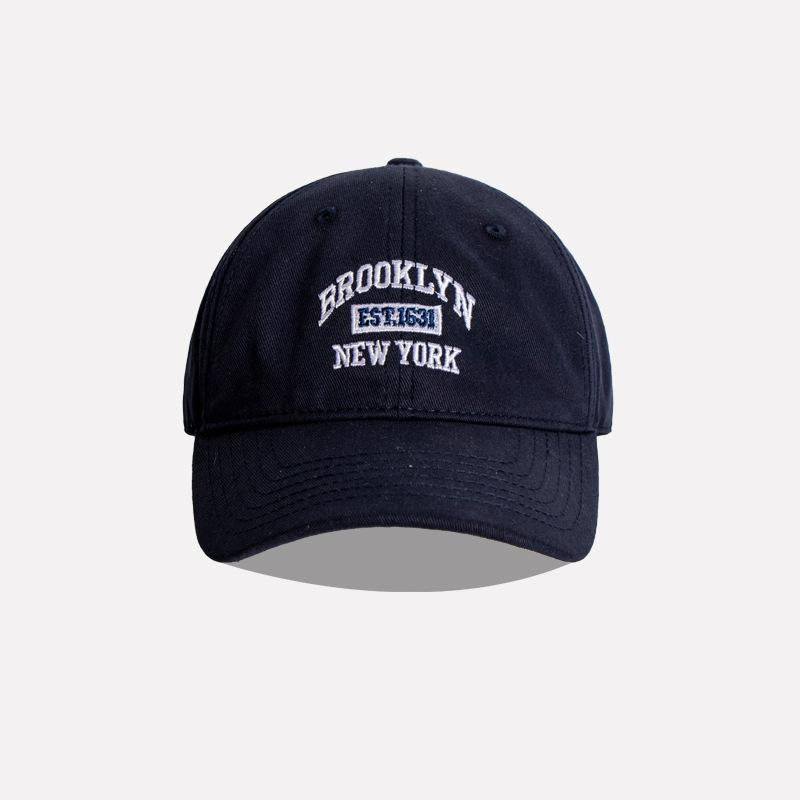 Yoghurt Zachte katoenen geborduurde honkbalpet voor dames, heren, casual, buitensporten, gebogen rand, klep, unisex, hiphop, dad caps donkerblauwe kleur