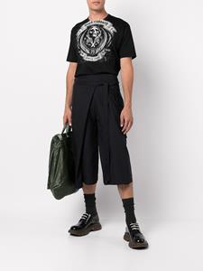 Junya Watanabe MAN T-shirt met doodskopprint - Zwart