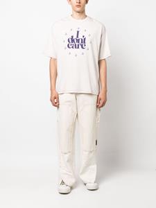 Undercover slogan-print cotton T-shirt - Beige