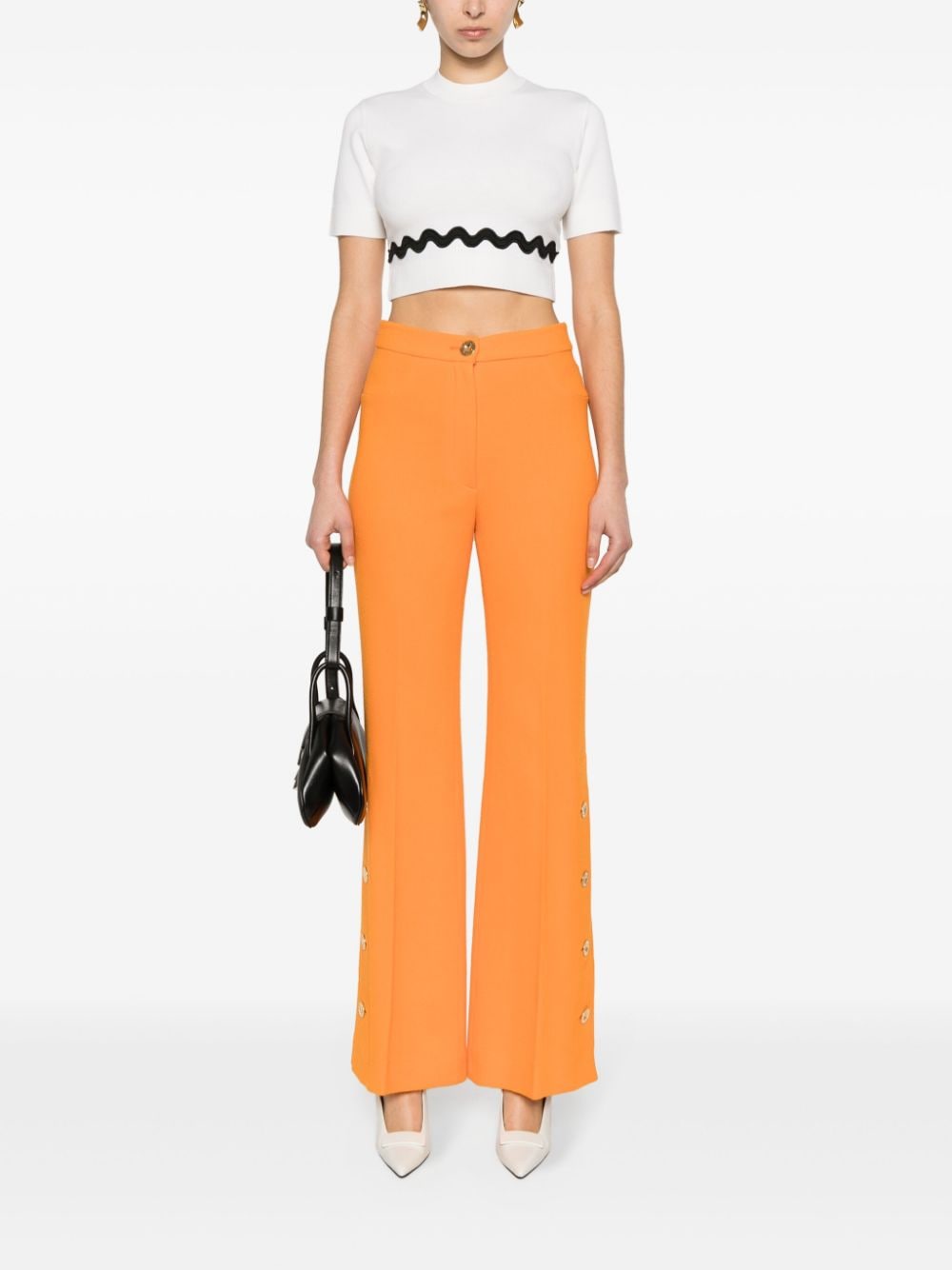 Patou side-buttoned tapered trousers - Oranje