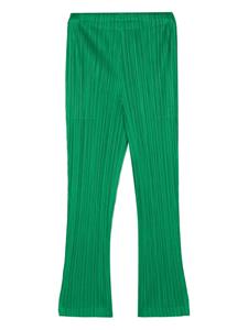 Pleats Please Issey Miyake pleated elasticated slim-fit trousers - Groen