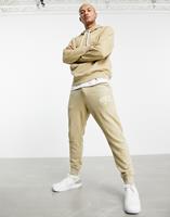 Nike Retro Arch - Losvallende joggingbroek in beige-Neutraal