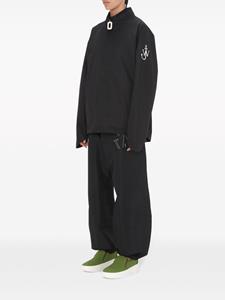 JW Anderson Twisted anchor-print track pants - Zwart