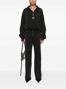 ROTATE Enzyme embroidered-logo trousers - Zwart