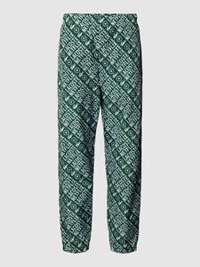 Lacoste Relaxed fit broek met all-over labelprint