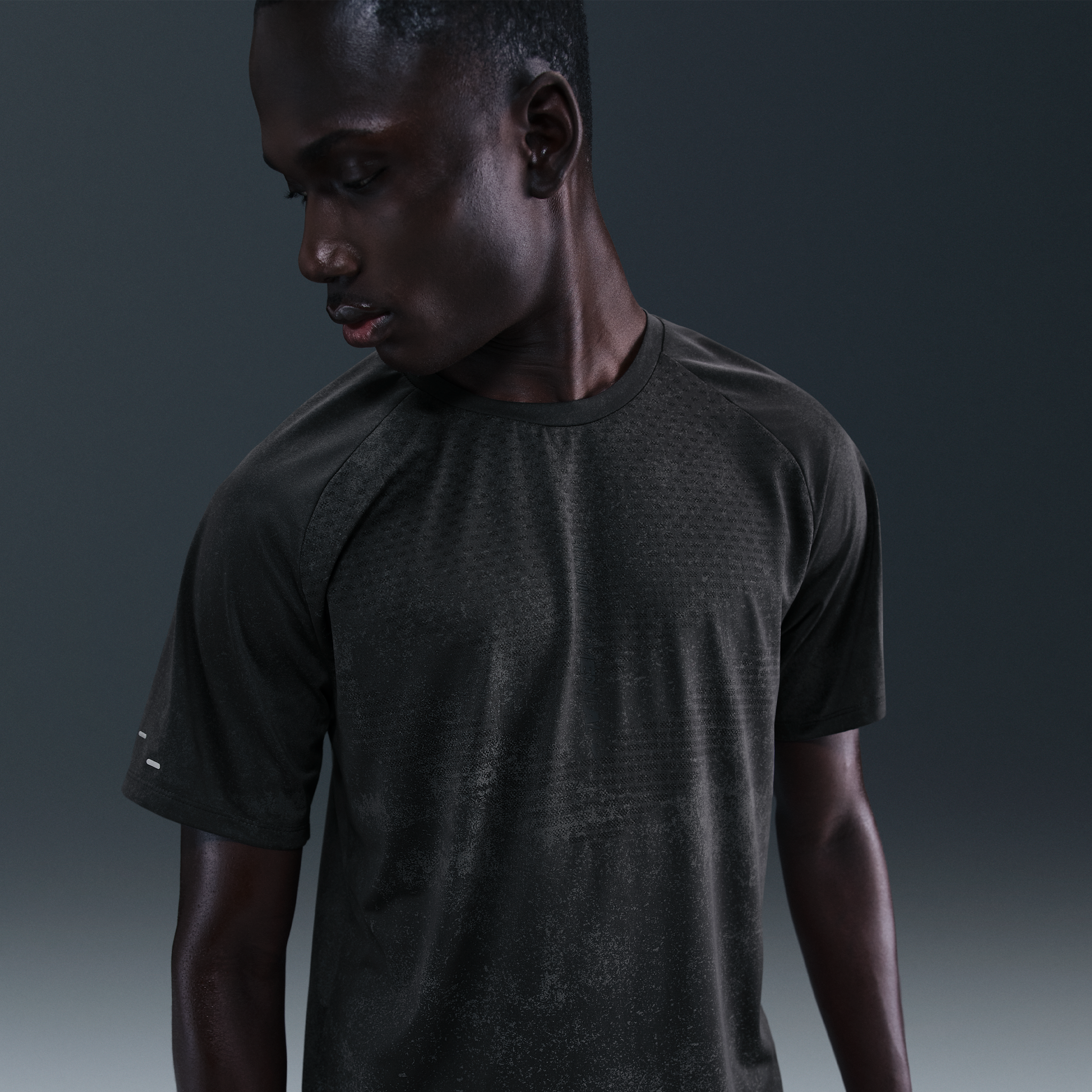 Nike Stride Dri-FIT ADV hardlooptop met korte mouwen en reflecterend design voor heren - Zwart