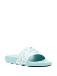 Moncler Slippers met logoprint - Blauw