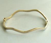 Christian Gouden bicolor slavenarmband golvend model geel goud