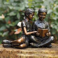 Gartentraum.de Mädchen & Junge lesen - Gartenfigur aus Bronze - Anna & Timo