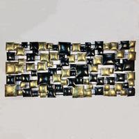 Gartentraum.de Lange 2er-Set Wand Metall Dekoskulptur in Kissenoptik in Schwarz/Gold - Ekina Gold