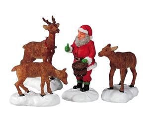 LEMAX Santa feeds reindeer 